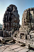 Angkor Thom - Bayon temple, second enclosure, corner towers seen from the central terrace 